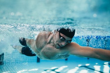 Fit swimmer training in the pool