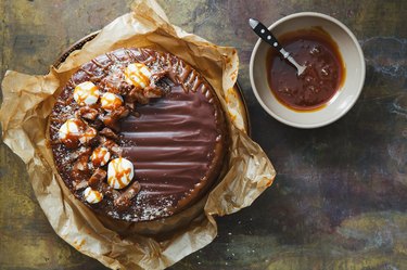 Chocolate cake on a wooden background.