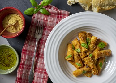 Rigatoni pasta Bolognese Vegan dish with nutritional yeast