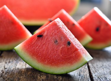 watermelon slices on a wooden background