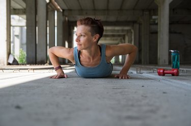 Girl doing push-up exercise outdoor