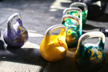 Colorful kettlebells on gym floor for weight training for weight loss
