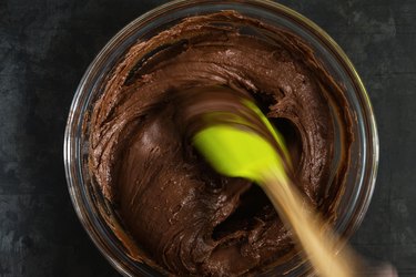Mixing chocolate cake brownies batter in bowl