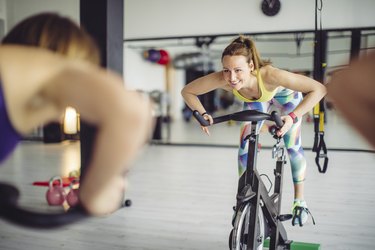 instructor on indoor cycling bike