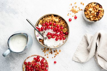 Oat granola with natural yogurt and red currant berries