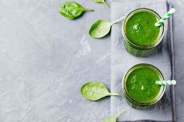 Spinach smoothie Healthy drink in glass jar. Top view