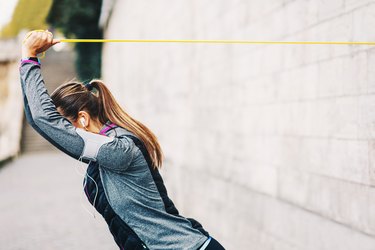 Woman training with resistance band