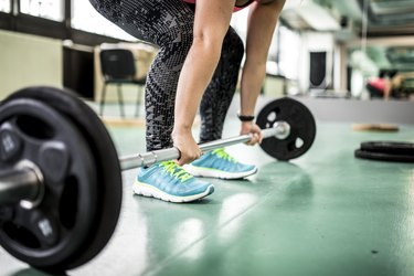 Picking up the barbell