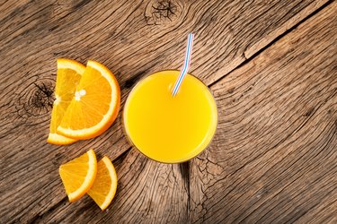 Orange juice in a glass. Citrus fruit drink