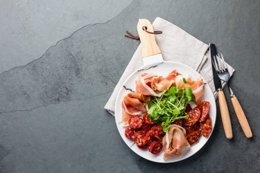 Plate of iberian spanish antipasto - ham serrano and salami