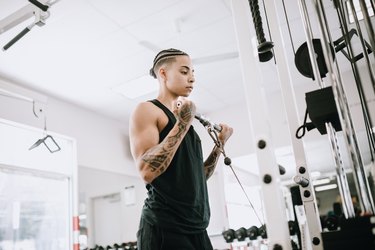 Strong and Fit Woman Working Out in Gym