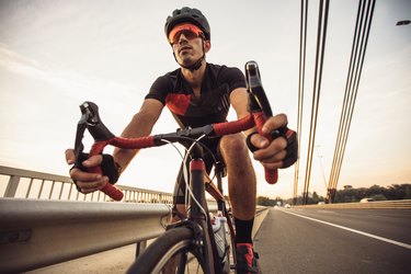 A man riding a racing bicycle on the street