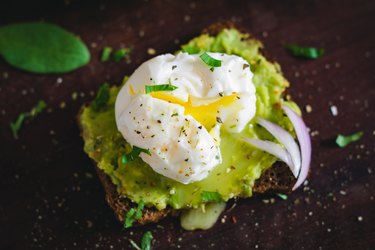 Avocado and poached egg sandwich, close up