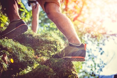 Hiker climbing on rock