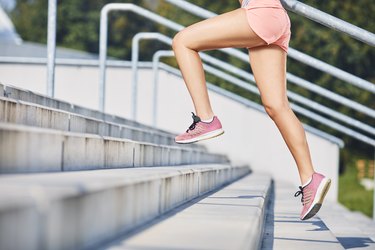 Close-up of woman running on stairs