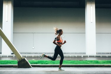 Sportswoman running in the city