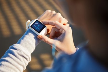 close view of a person checking their heart rate variability on their smartwatch