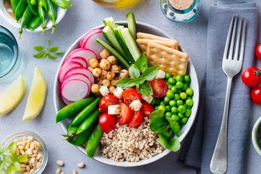 Healthy vegetarian salad. Buddha bowl. Grey stone background. Top view.