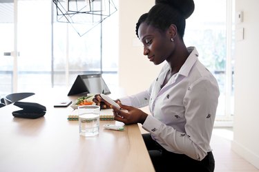 African-American woman taking blood sugar level in different time of the day