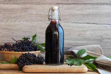 Black elder syrup, berries and leaves