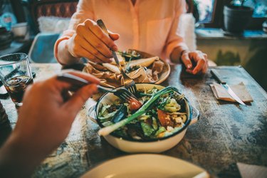 Sharing food salads on table for antioxidants