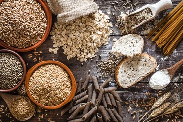 Whole-grain carb food still life shot on rustic wooden table