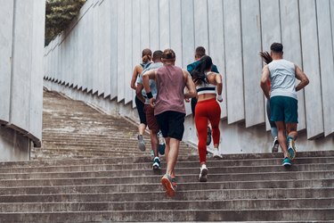 Full length rear view of people in sports clothing