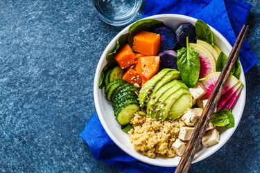 vegan quinoa salad with tofu, avocado and vegetables
