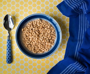 Bowl of cereal and blue kitchen towel