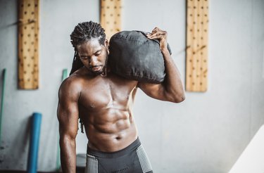 Man exercising with a sandbag