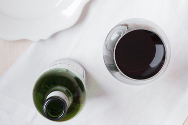 Directly Above Shot Of Red Wine With Bottle On Table