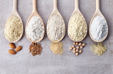 Various gluten free flours on wooden spoons