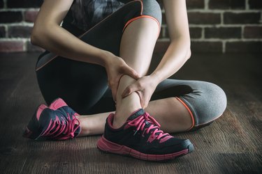 her ankle injured in gym fitness exercise training, healthy