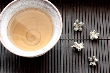 Teacup and white tea shaped into flowers