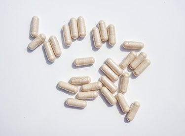 Directly Above Shot Of Capsules On White Background