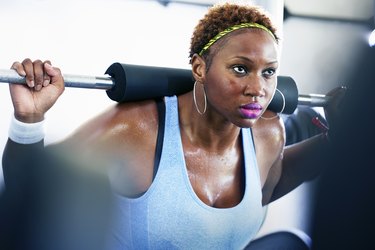 Woman lifting weights at the gym