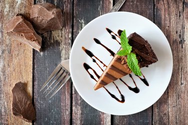 Chocolate cheesecake above view over rustic wood