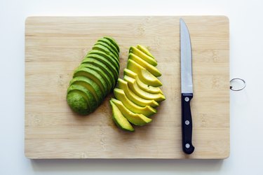 Freshly cut sliced avocado on a cutting board