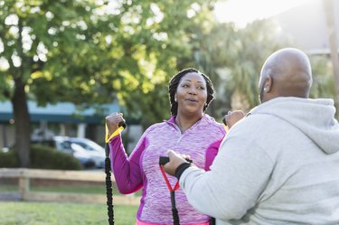 African-American couple exercising with resistance bands