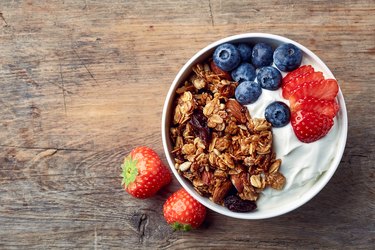 Homemade granola with yogurt and fresh berries