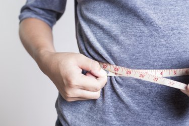 Woman Checking Waistline