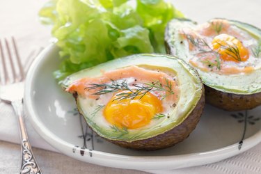 Baked smoked salmon, egg in avodaco, ketogenic keto low-carb diet food