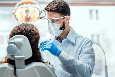 a dentist working on a patient who has dental anxiety