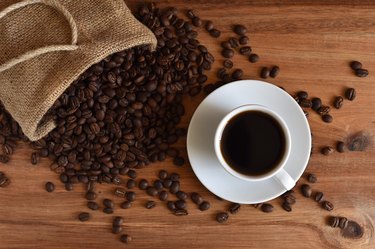 Close-Up Of Coffee Up With Beans On Table