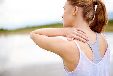 back view of a woman with muscle pain from chronic inflammation