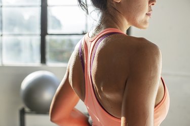 Midsection of athlete standing in the0 gym