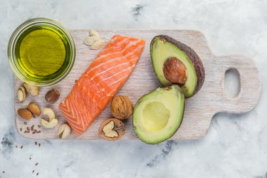 Selection of good fat sources - healthy eating concept. salmon avocado