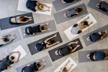 People doing Child's pose on eco-friendly yoga mats