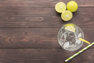 Fresh soda, lime on a wooden background