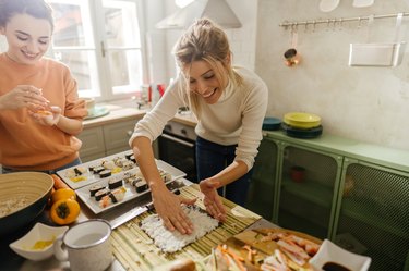 Friends making sushi at home